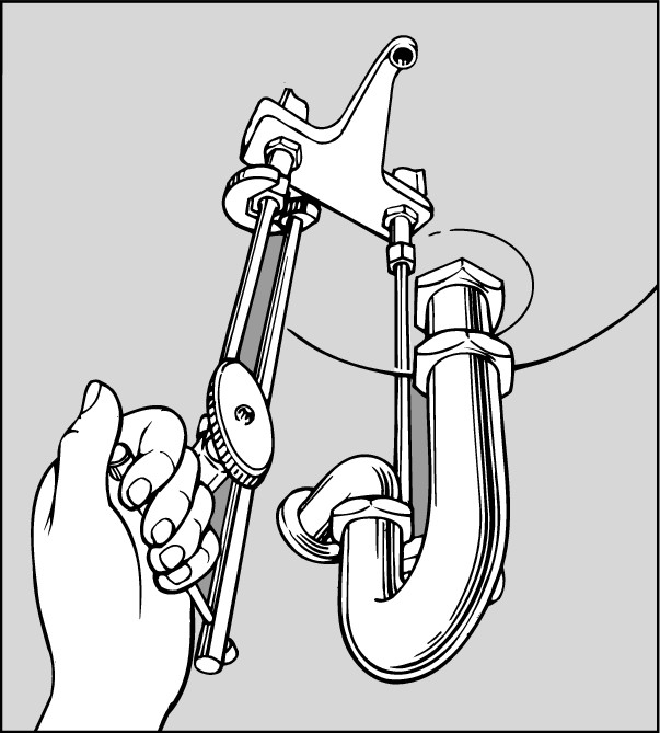 Figure 3-9: A plastic nut basin wrench makes a tough job a little easier after you get the hang of using it.